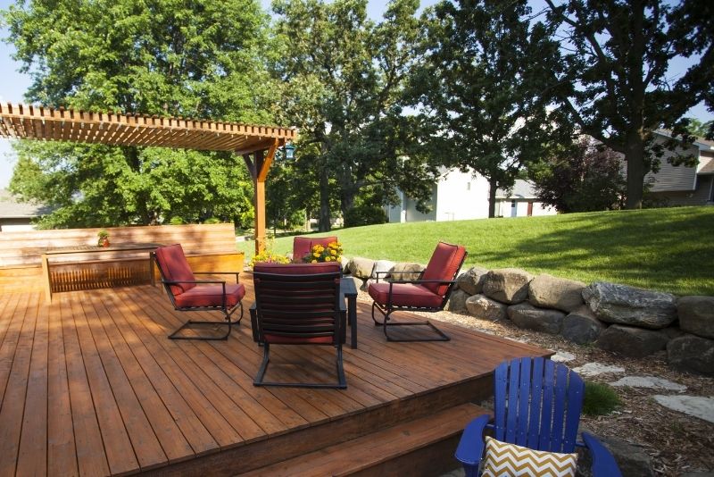timber pergolas and decking with chairs