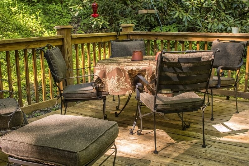 chairs and tables on outside house decking patios